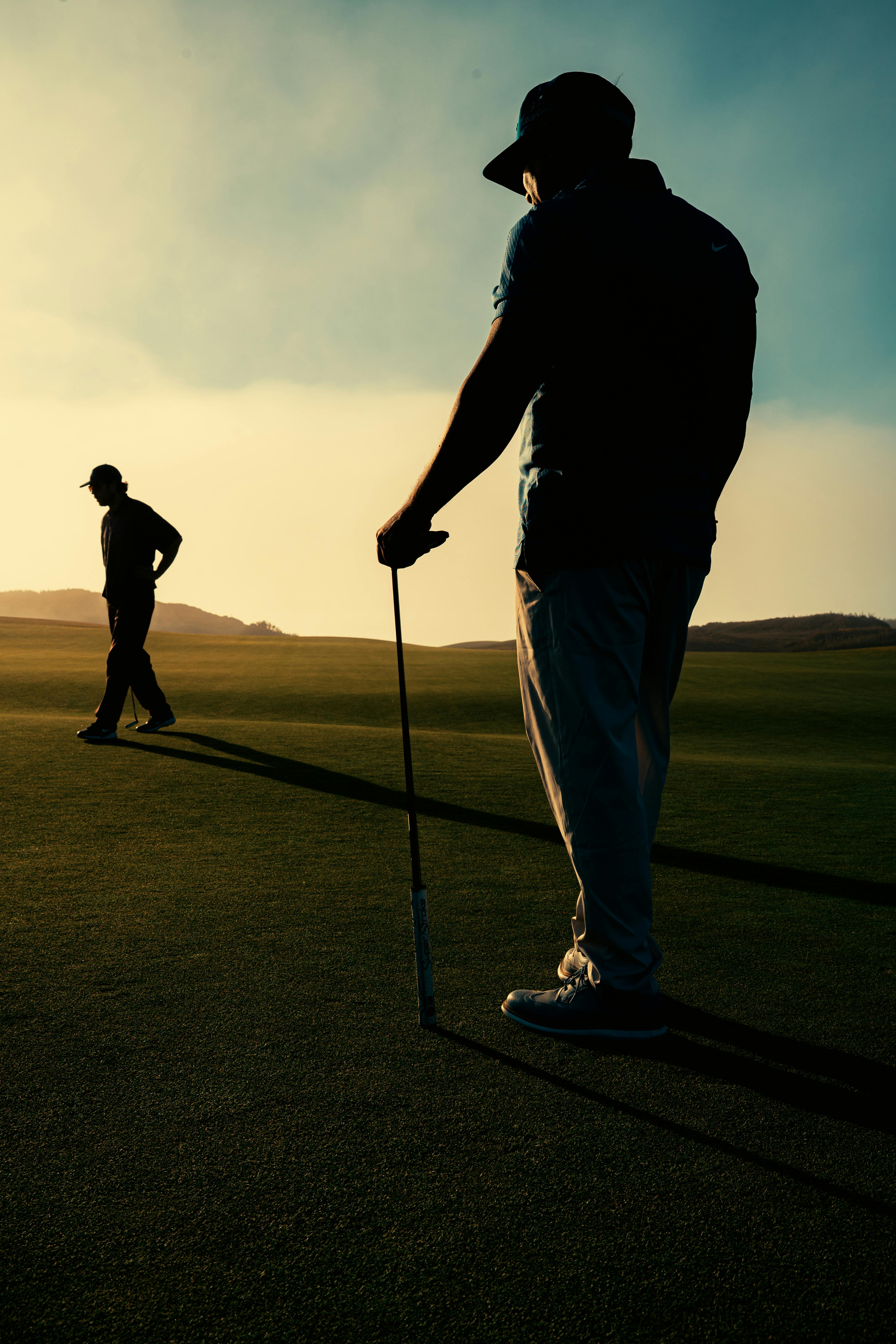 Man enjoying a round of golf while his AI handles the work